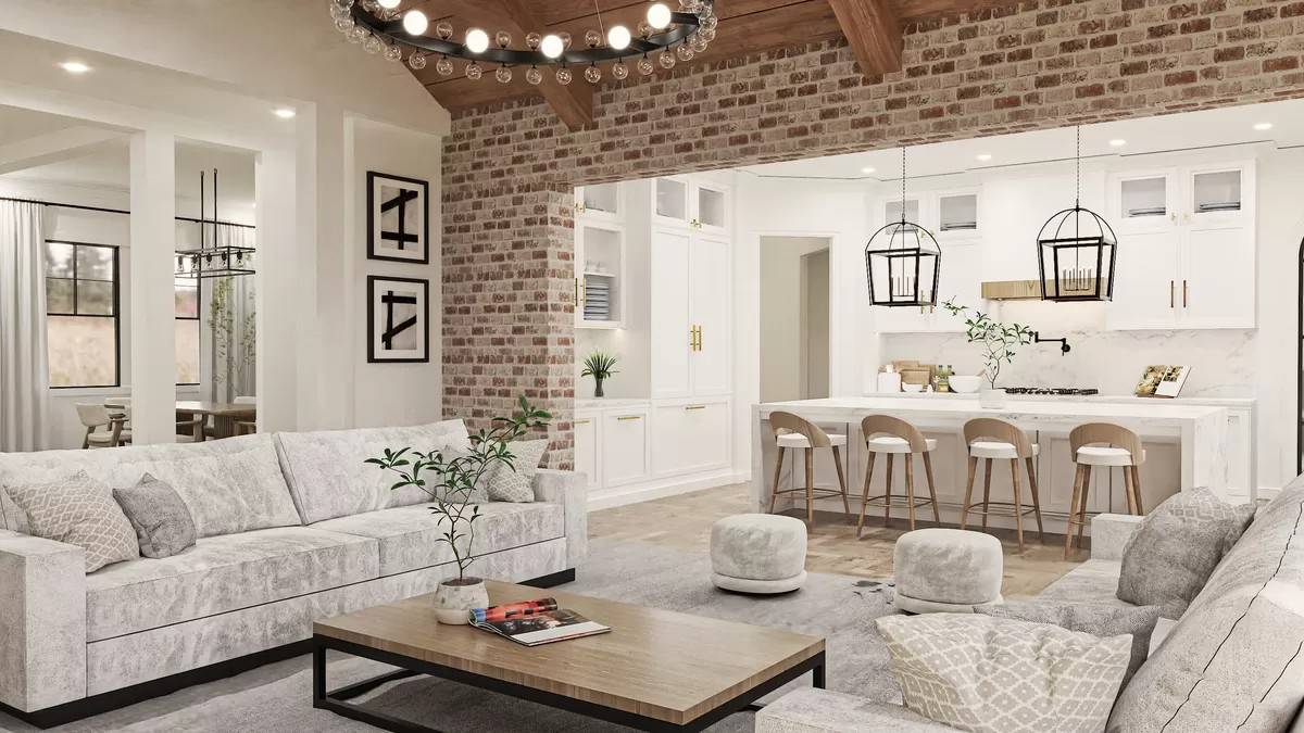 Family room and kitchen connected by a brick opening.
