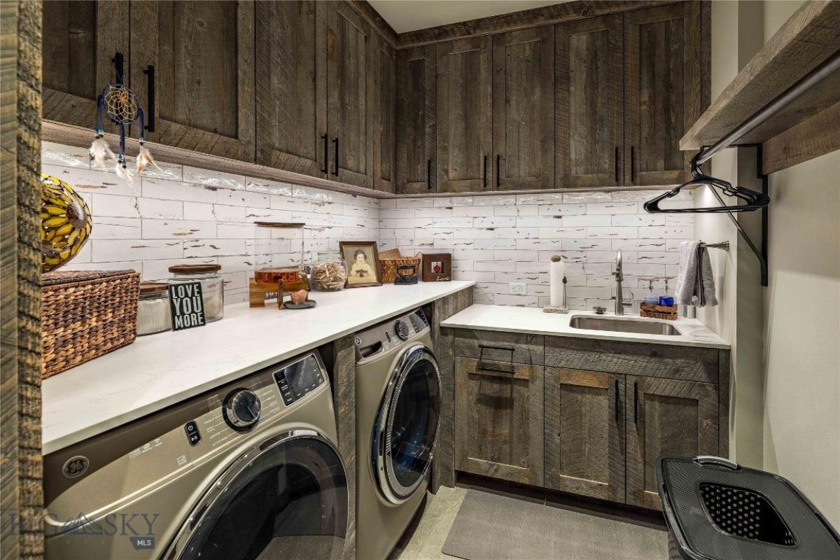 Laundry room with wooden cabinets.