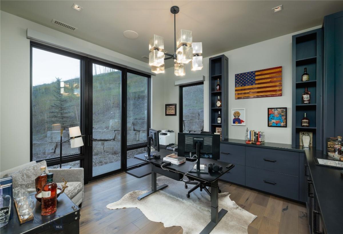 Home office with expansive sliding glass doors.