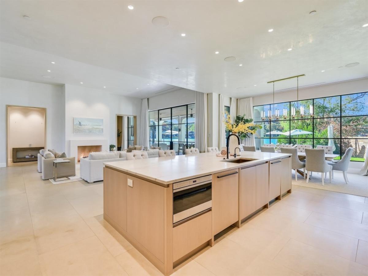 Great room with custom lights and glass walls.