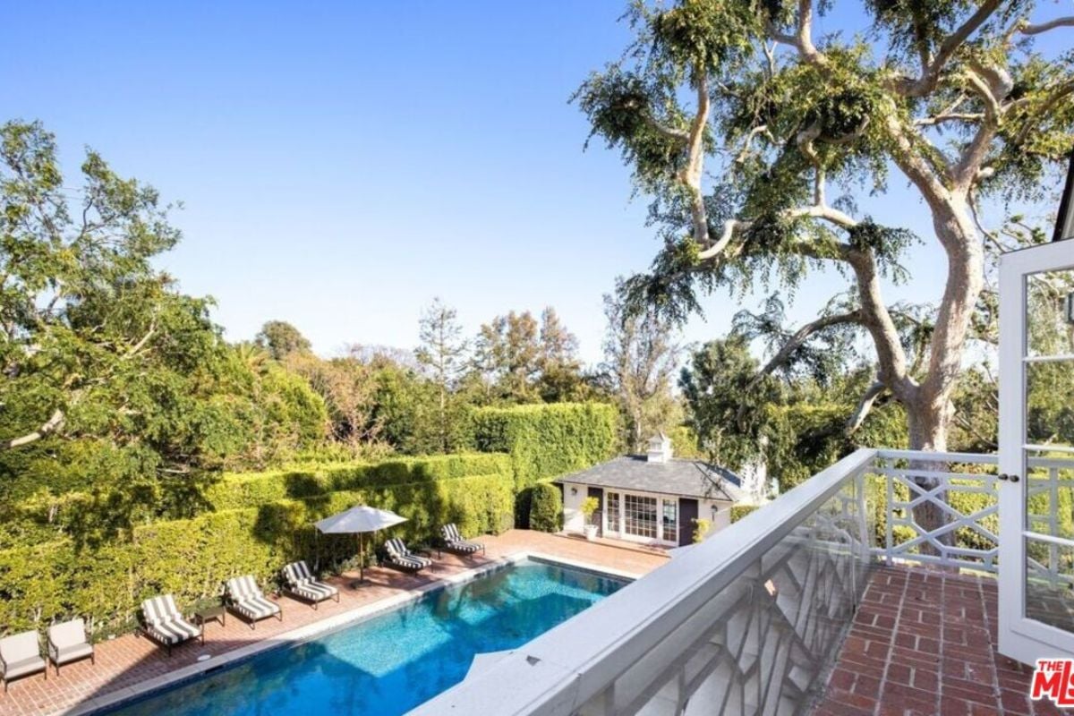 A view of the swimming pool from the balcony.
