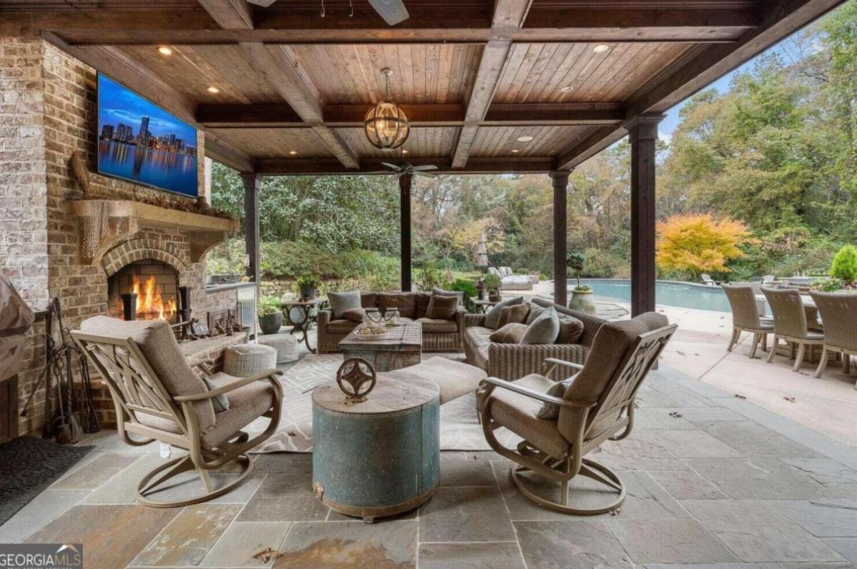 Outdoor living space with a fireplace.