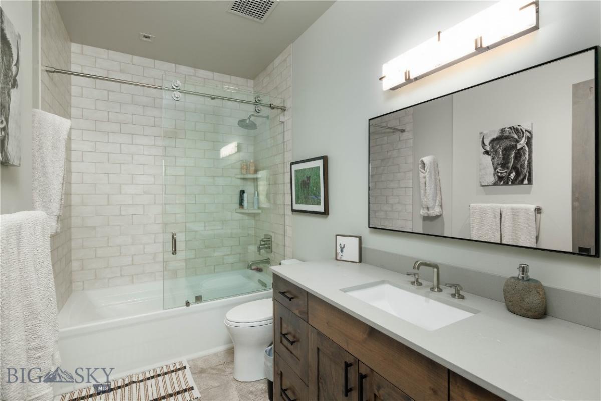 Bathroom with a sink, toilet and shower.