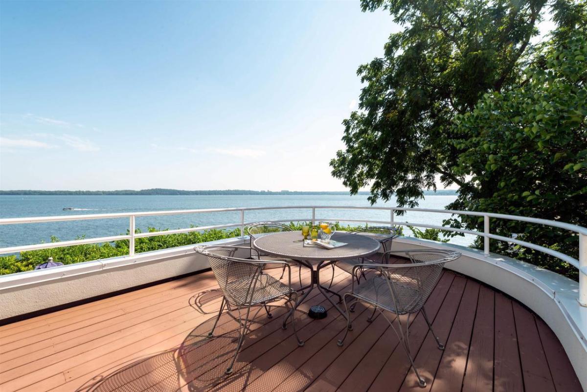 Balcony with a table and chairs.
