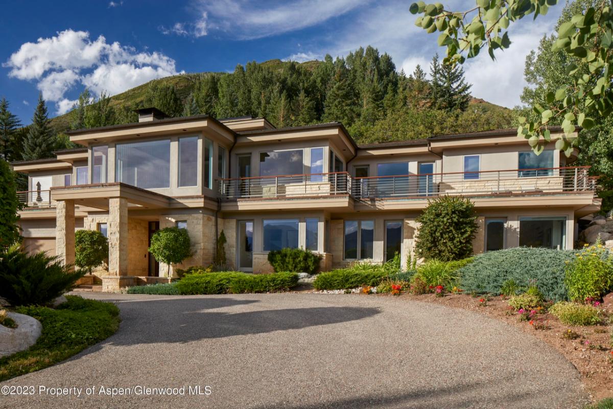 Exterior view of the property with a driveway.