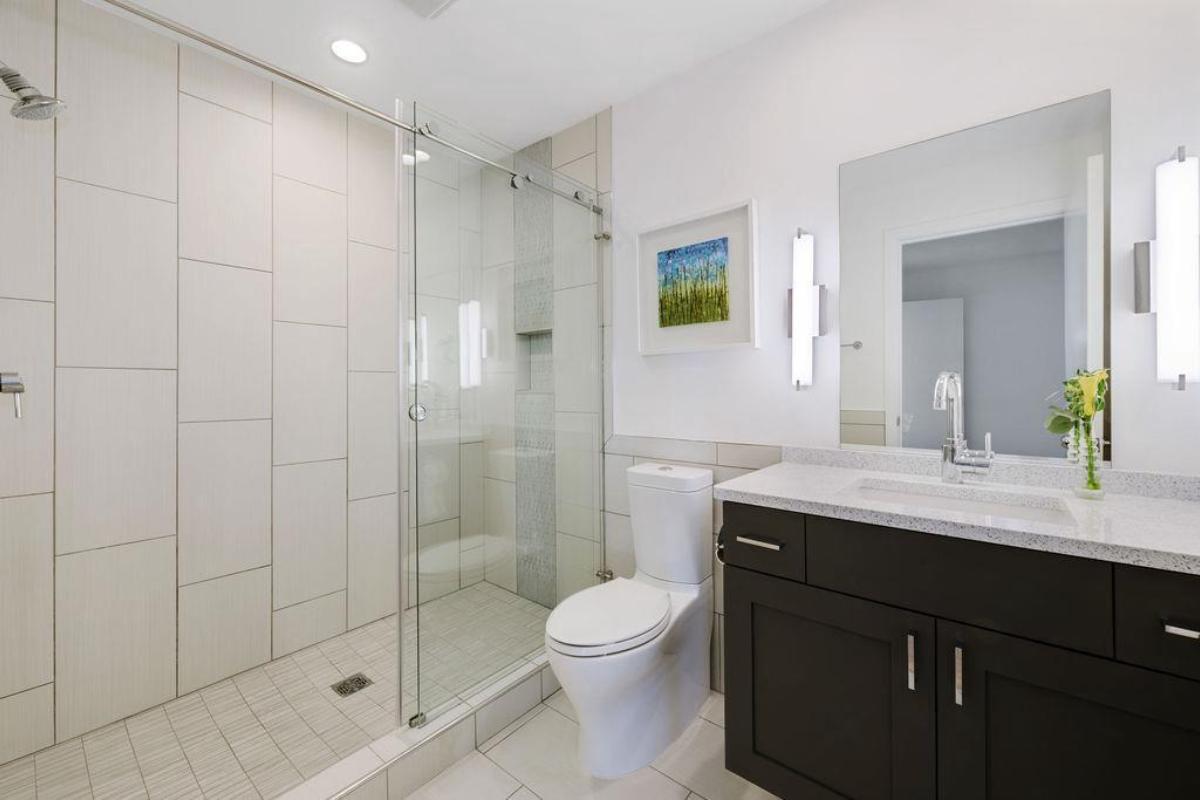 Bathroom with a sink, toilet and a shower.
