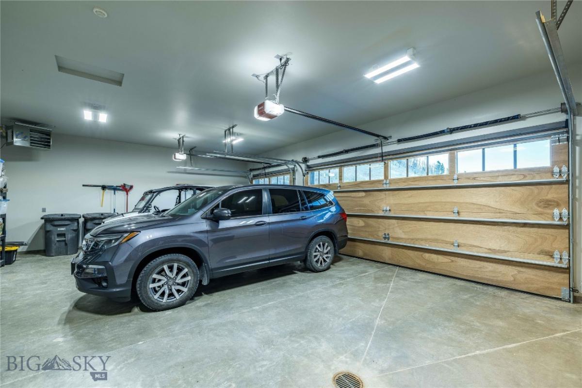 Garage with automatic garage door opener.