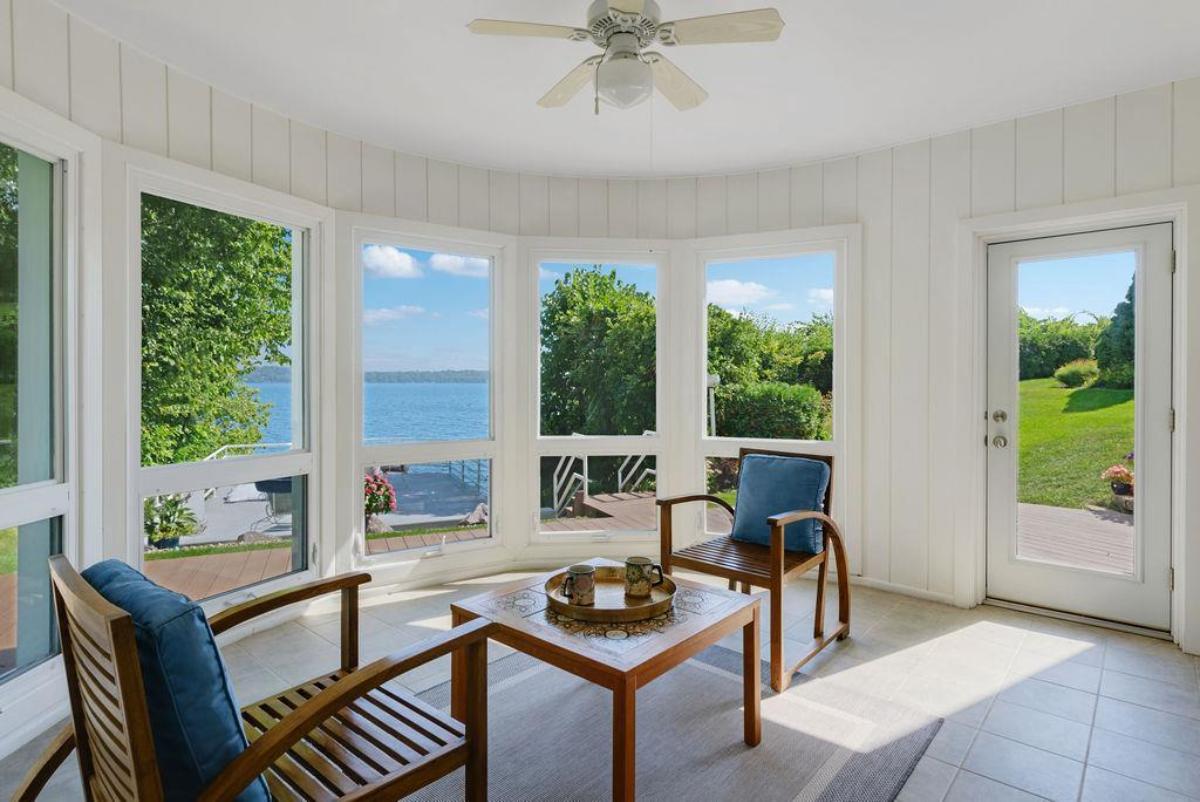 Cover patio with a table and chairs.