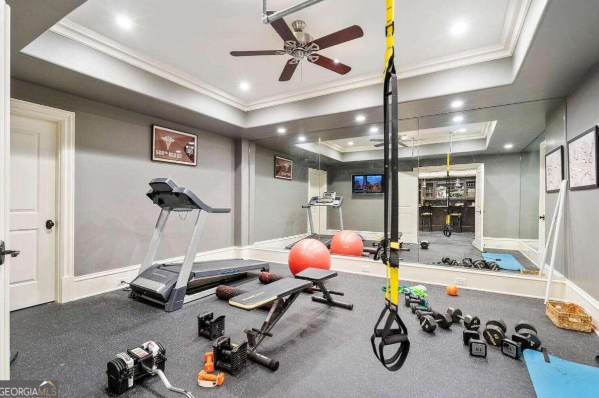 Home gym with workout equipment.