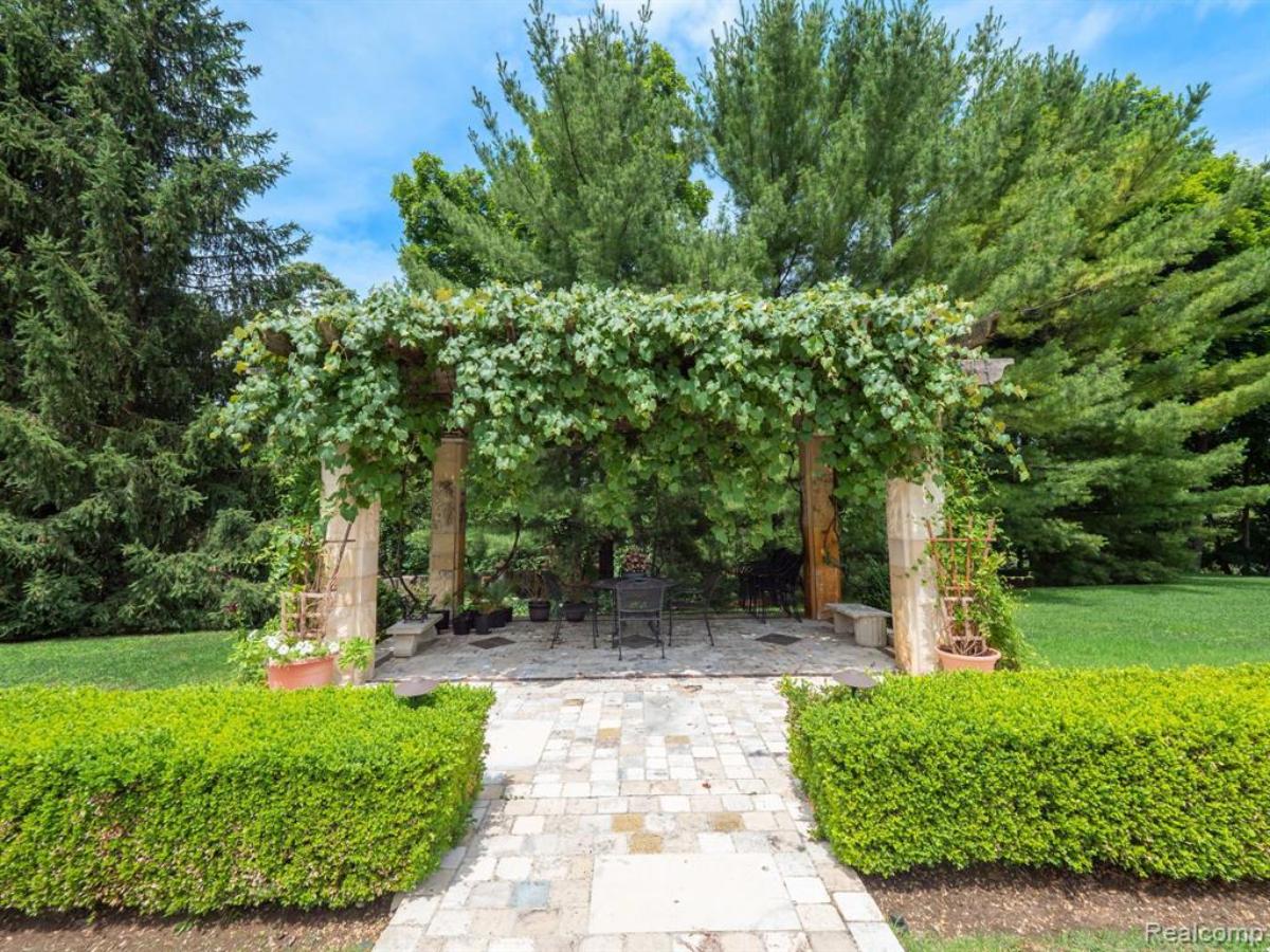 Pergola with a stone walkway.