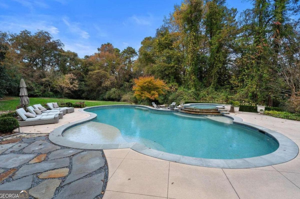 Pool with lounge chairs.