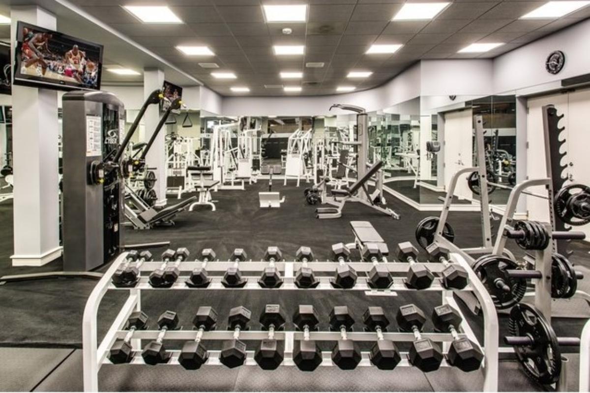 Home gym with lots of workout equipment.