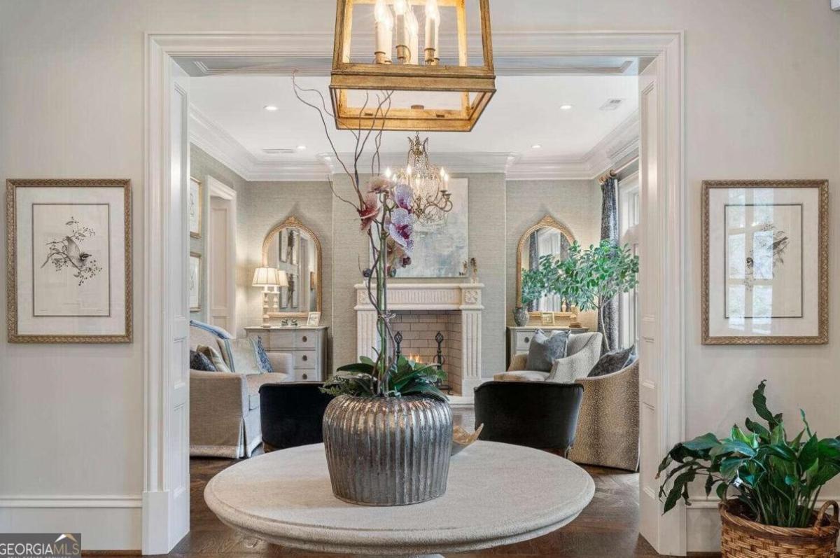 Living room with couches and a fireplace.