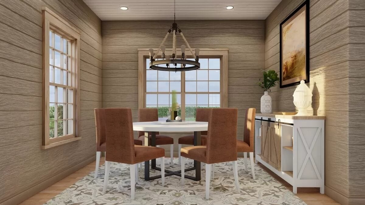 Dining room with a round dining set and a buffet table adorned by decorative vases and a framed artwork.