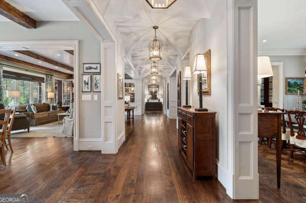Hallway with chandeliers.