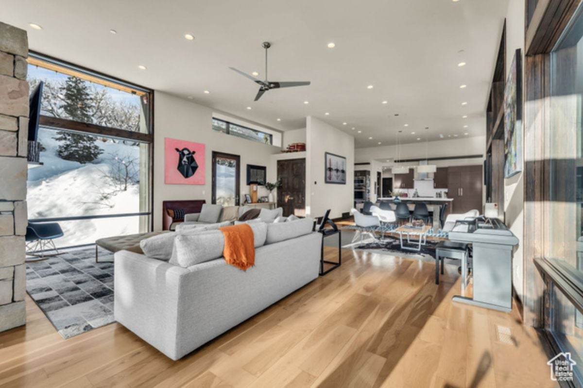 A great room with a wooden floor and white ceiling.