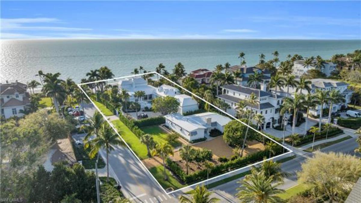 Aerial view of the property with a view of the waters.