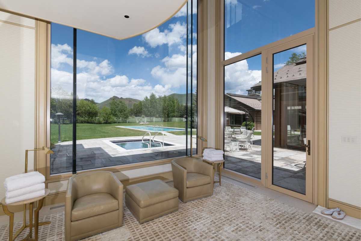 A seating area with couches and an ottoman.