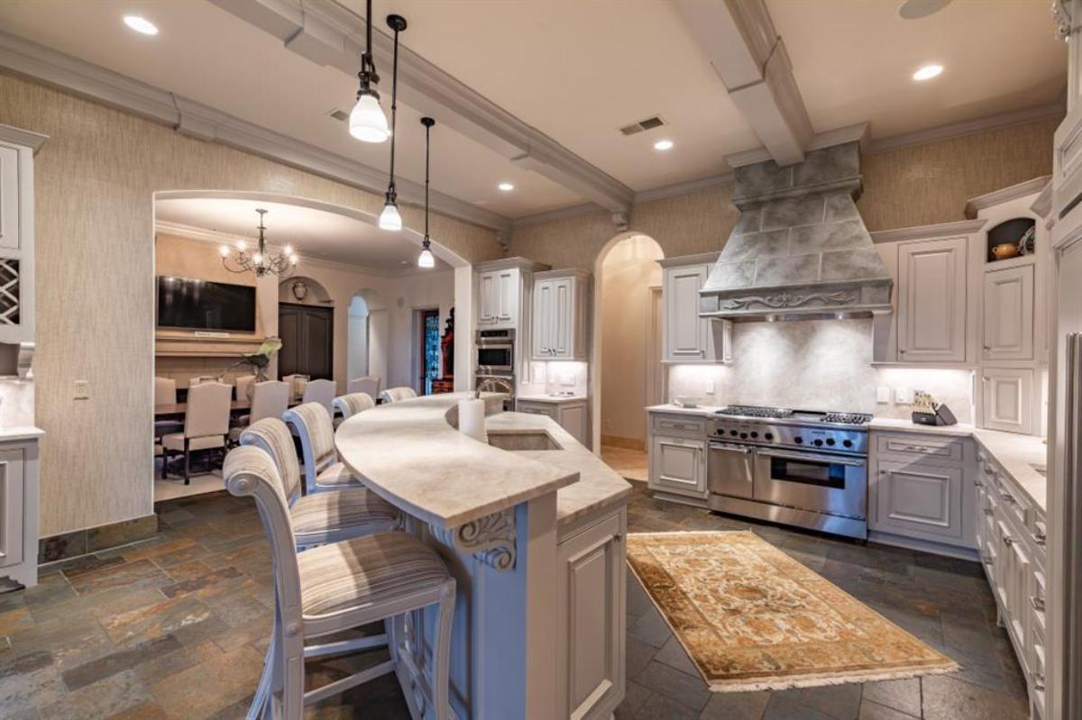 Kitchen with a large island and custom cabinetry.