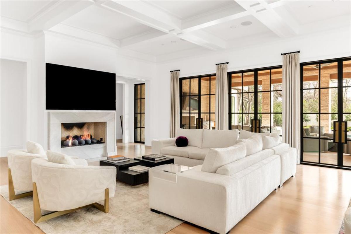 Living room with couches and a fireplace.