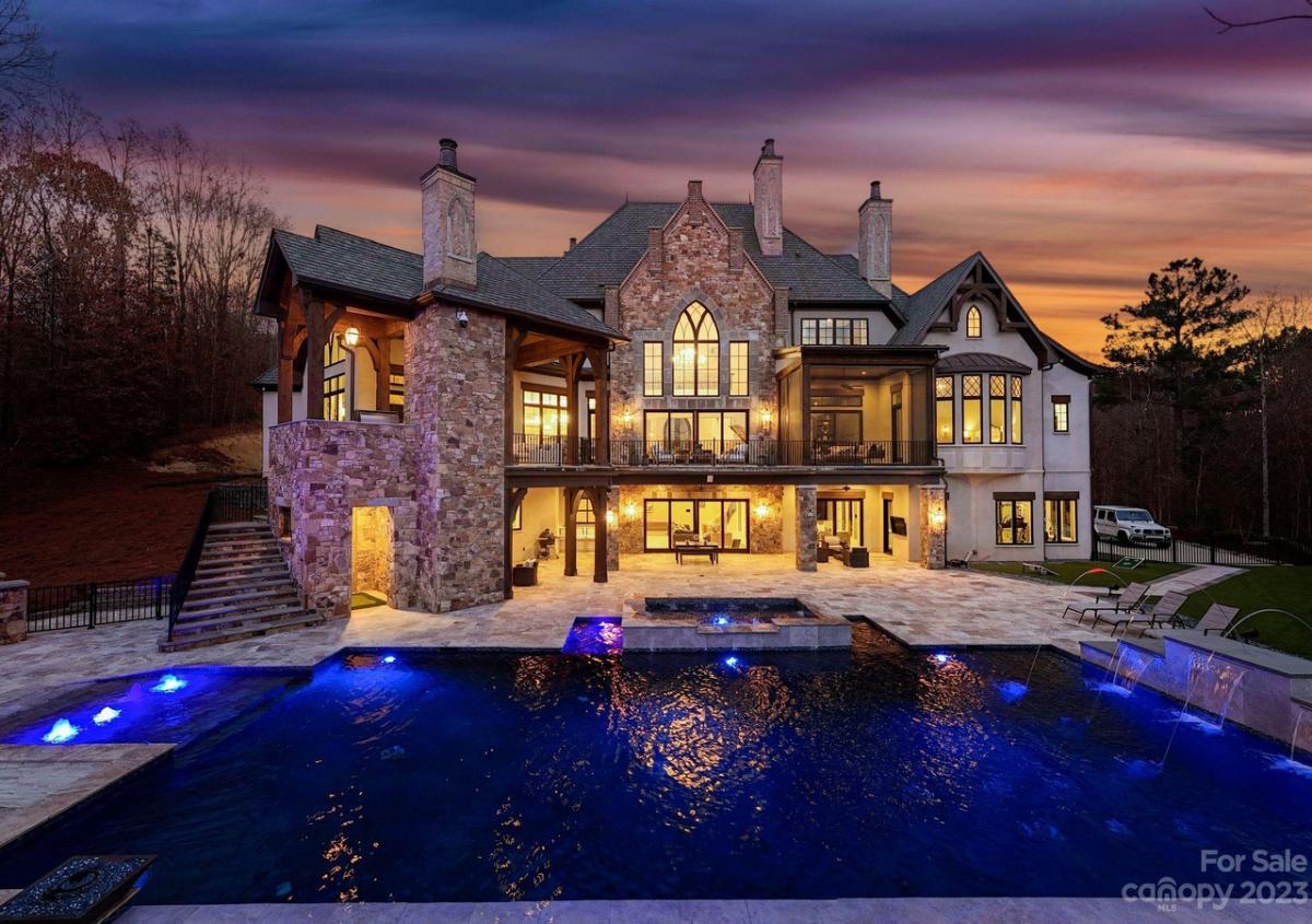 Rear view of the mansion with a pool.