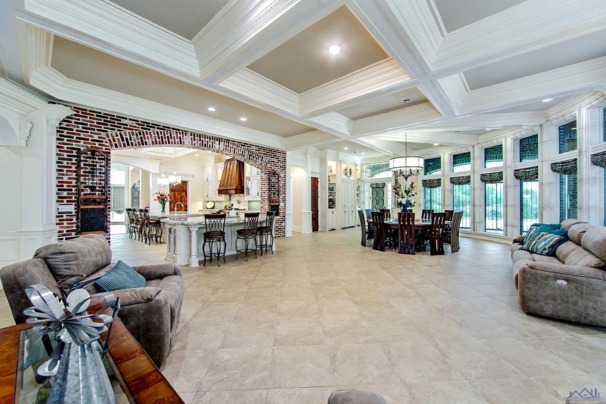 Great room with a living area, dining area and a kitchen.