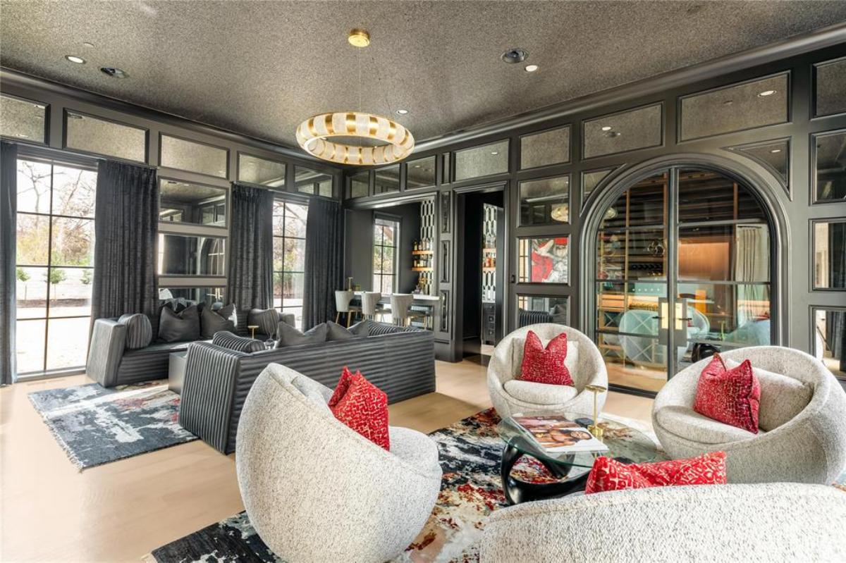 Living room with couches and custom lights.