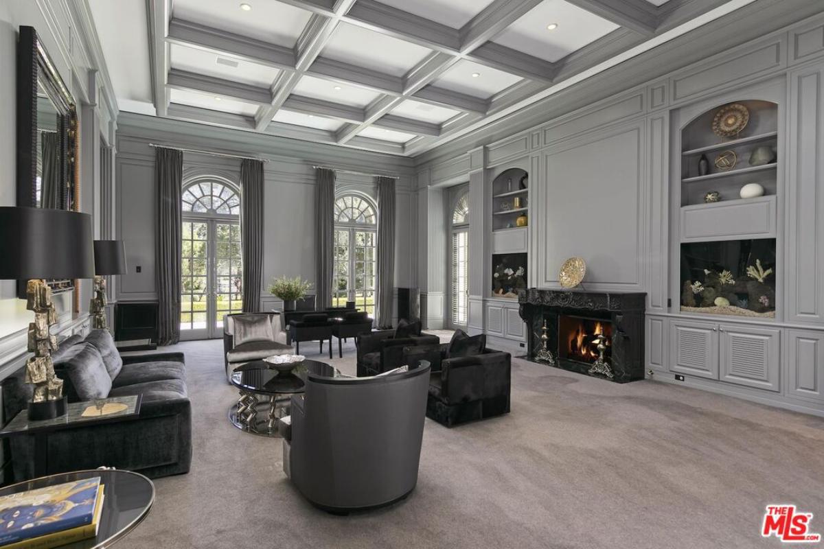 Home office with a living space and a fireplace.