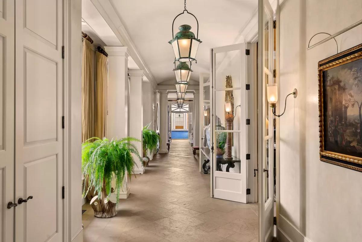 Hallway with a large painting on the wall.