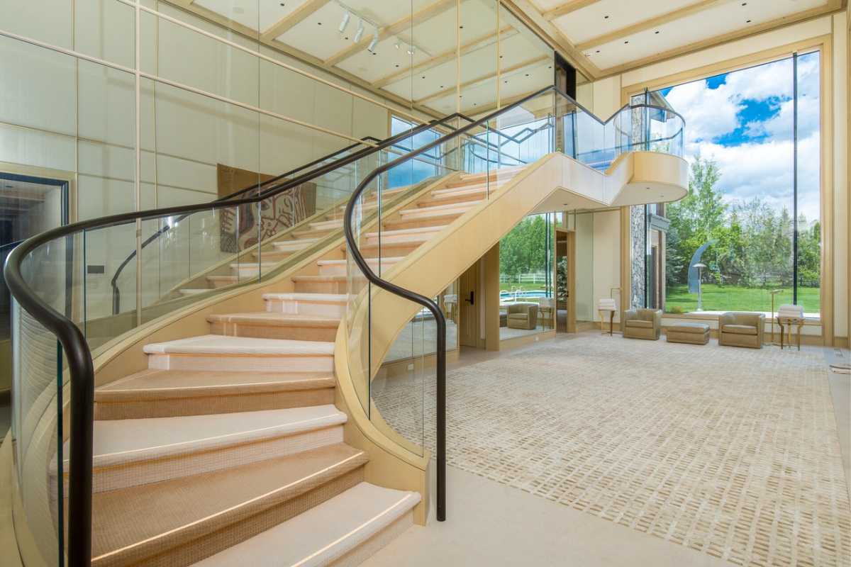 A glass staircase with a handrail.