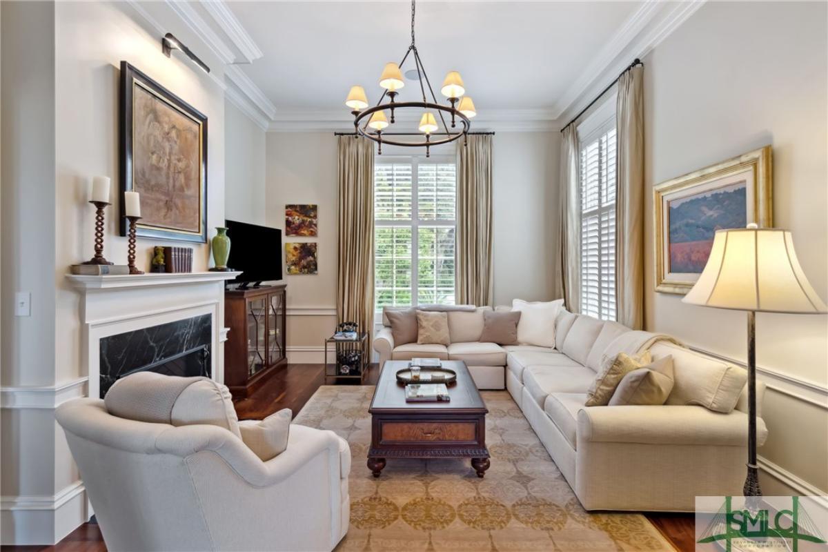 Living room with couches and a fireplace.