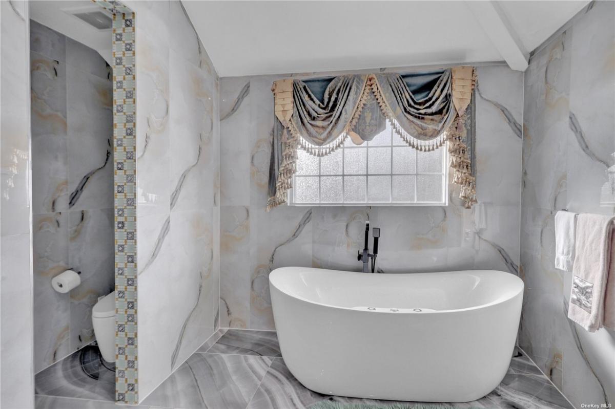 Bathroom with a soaking tub.