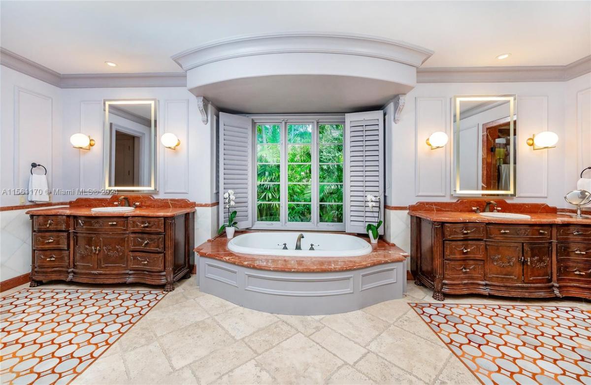 Bathroom with sinks and soaking tub.