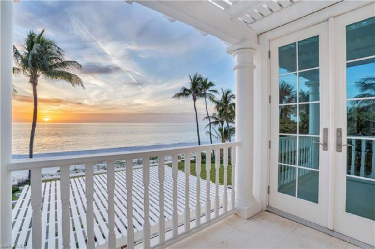 Balcony overlooking the ocean and a view of the sunset.