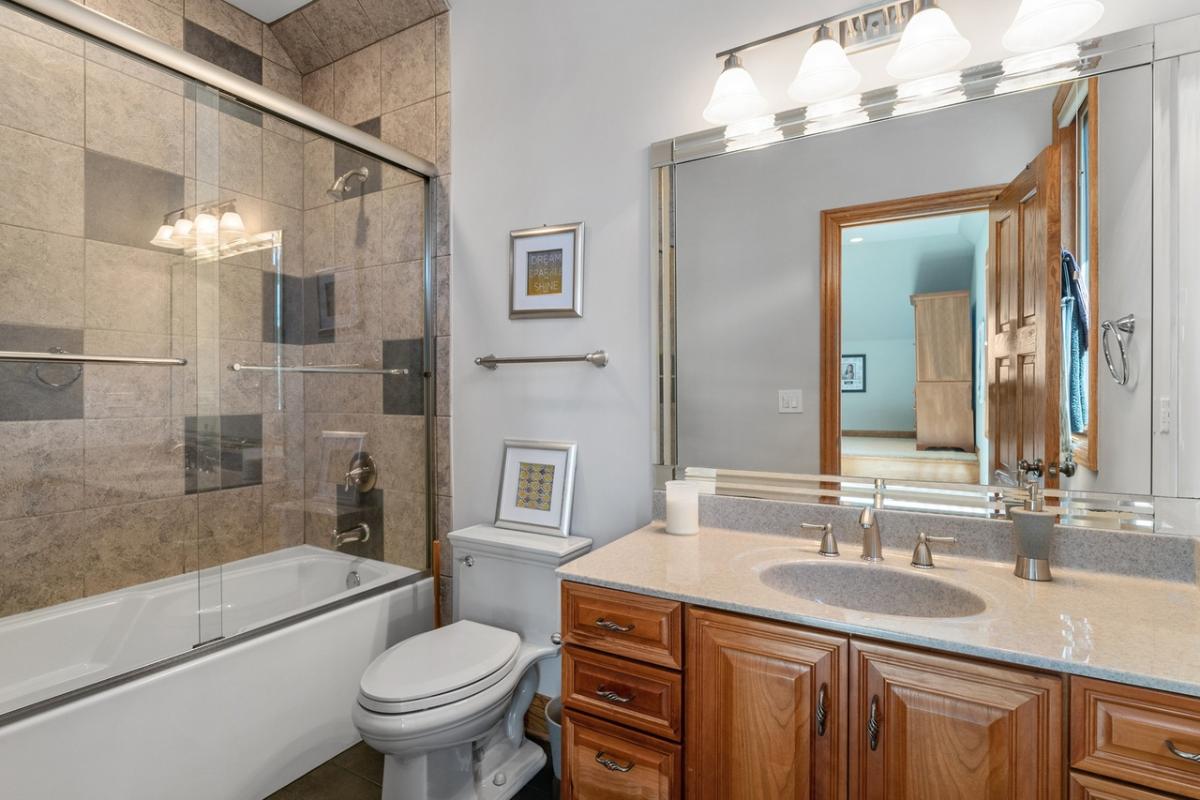 Bathroom with a sink, toilet and a soaking tub.