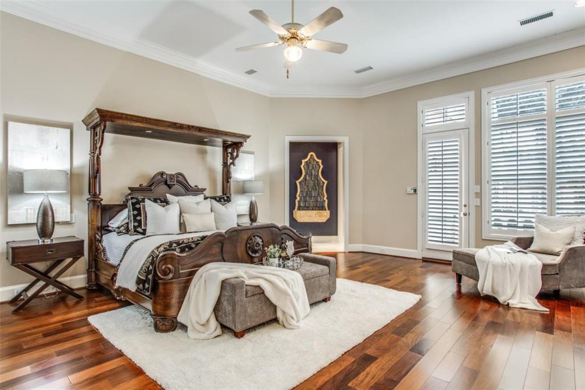 Bedroom with wood flooring and a couch.