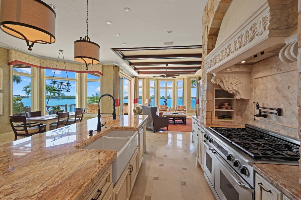 Great room with a kitchen, dining area, kitchen and living area.