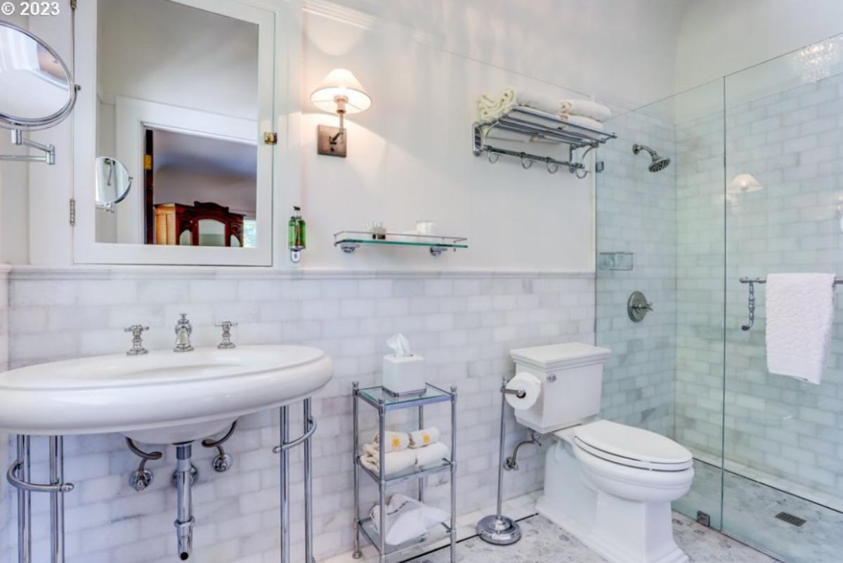 Bathroom with a sink, toilet and a walk-in shower.