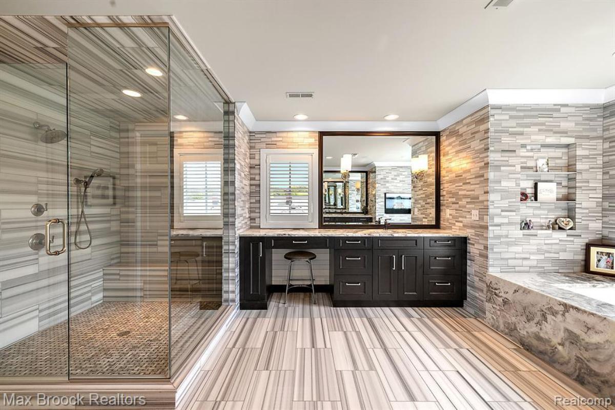 Bathroom with a mirror, soaking tub and walk-in shower.