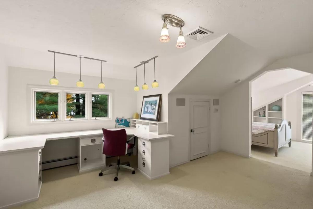 Study room with carpet flooring.