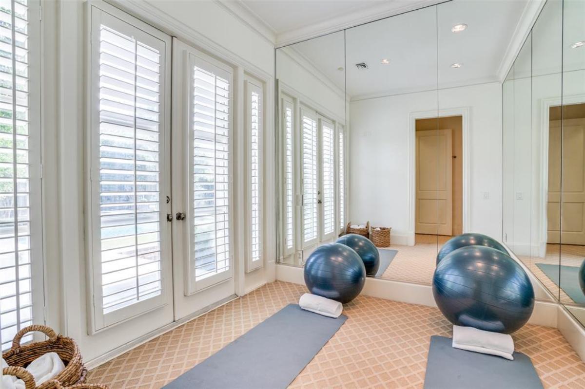 Yoga room with large mirrors.