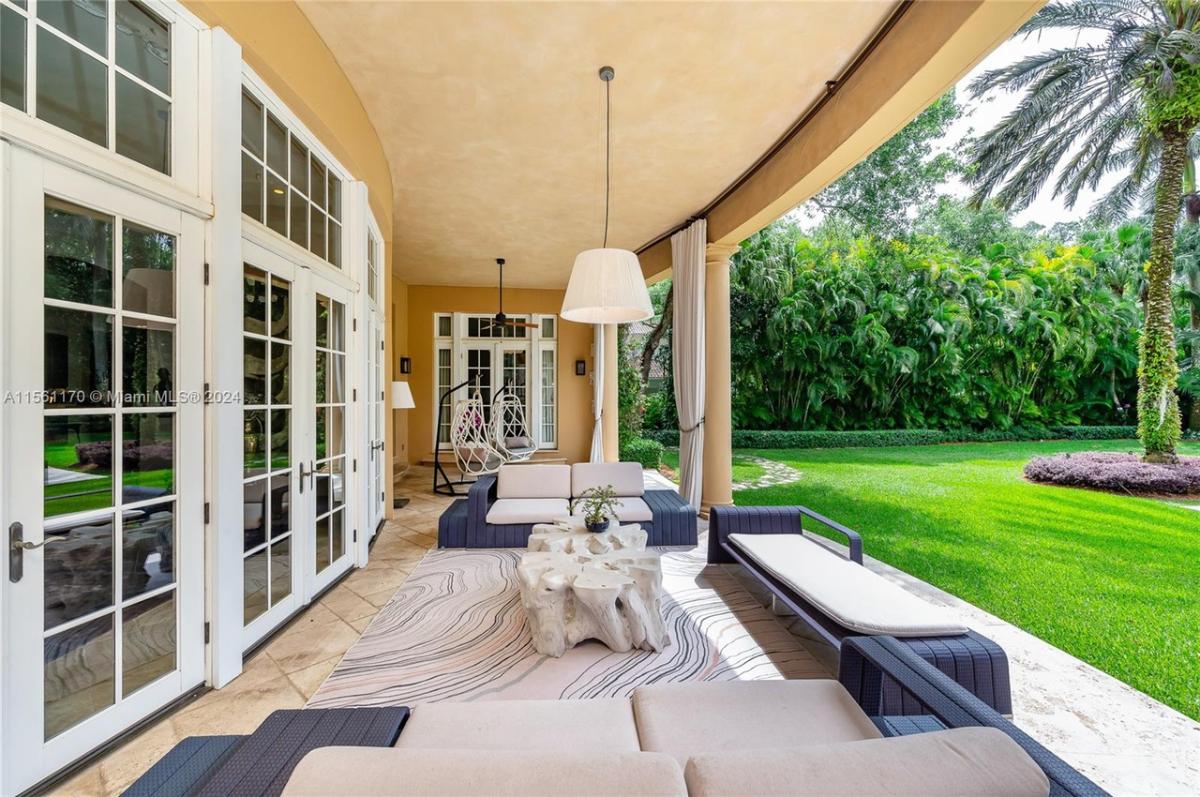 Covered patio with couches.