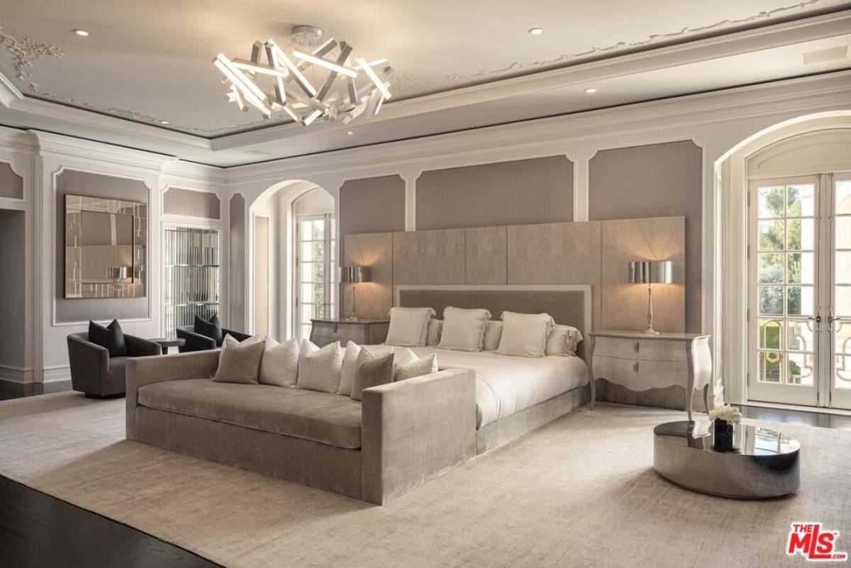 Bedroom with custom lights and glass doors.