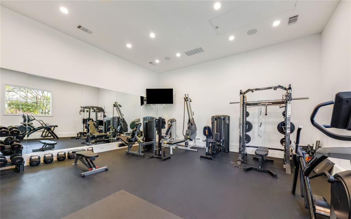 Home gym with workout equipment.