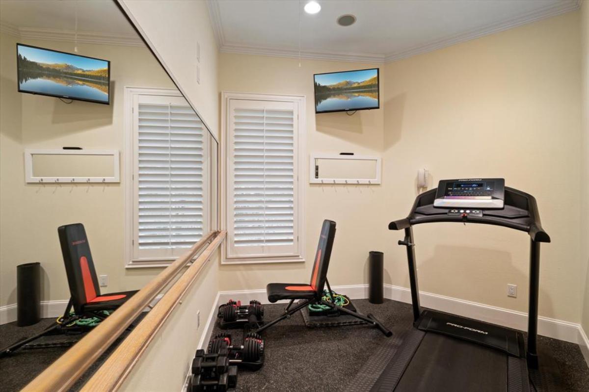 Home gym with workout equipment.