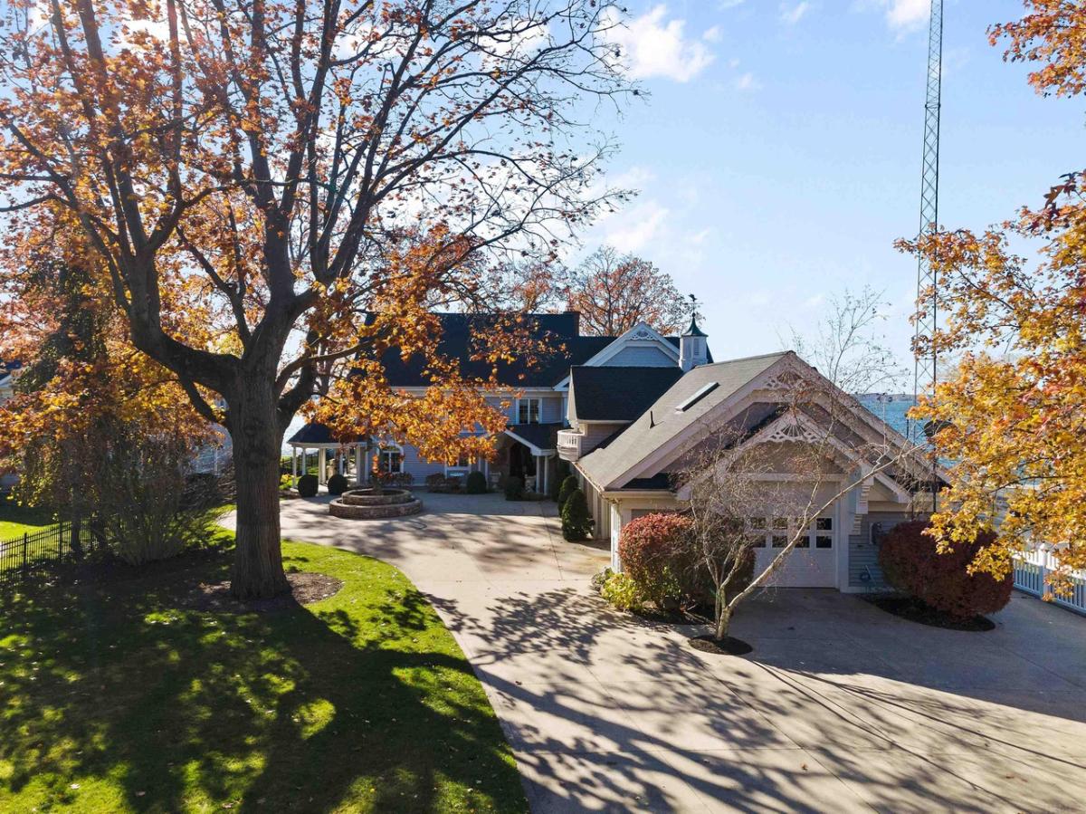 Exterior view of the mansion with a spacious driveway.