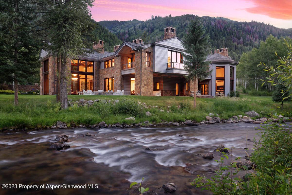 Rear view of the property with a river.