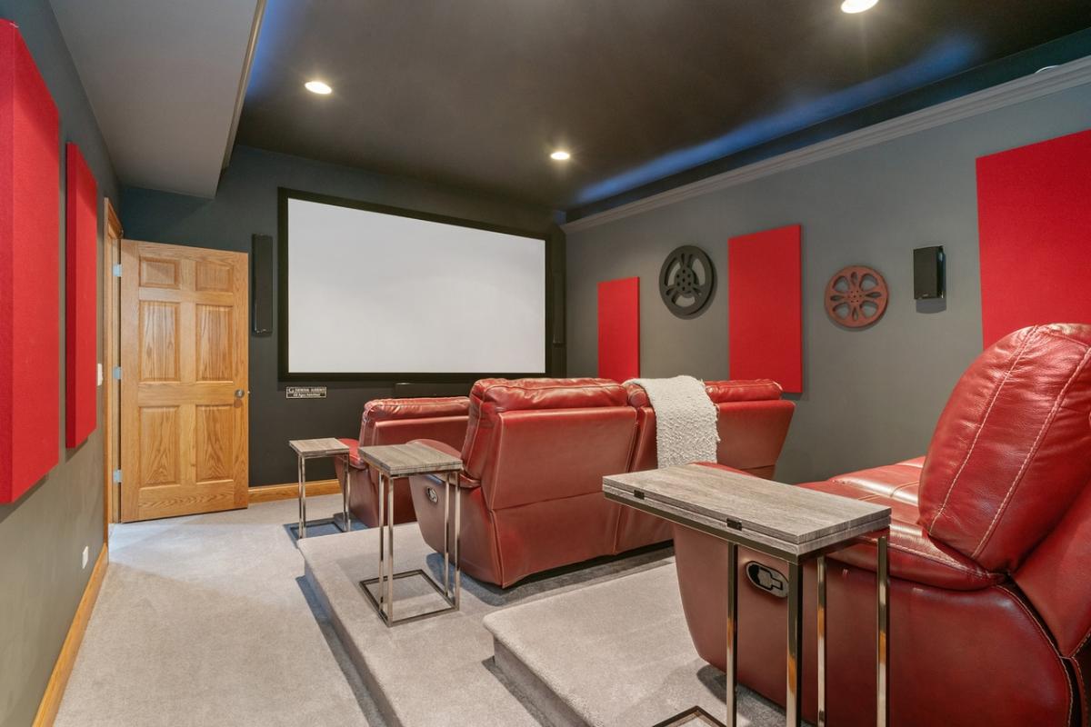 Home theater with carpet flooring.