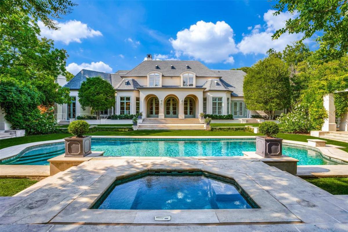 Rear view of the mansion with a pool.