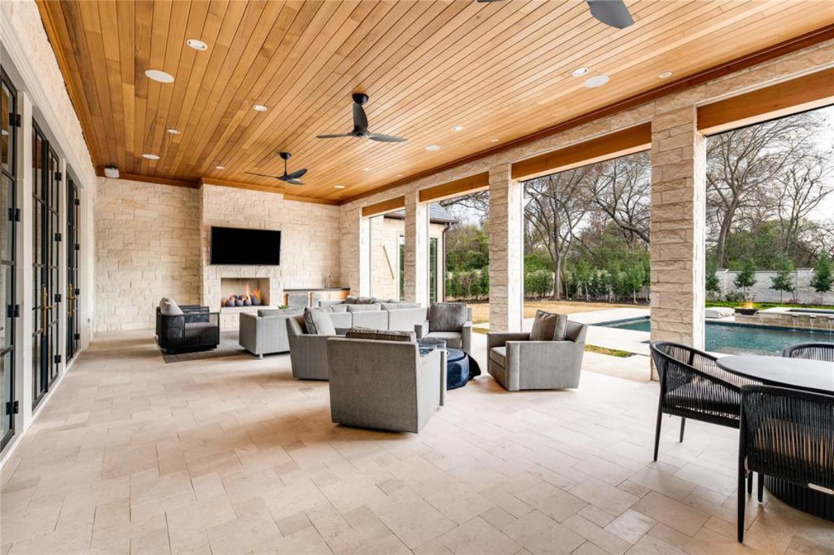 Outdoor living space with a fireplace.